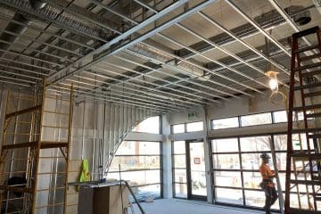 Drywall contractors of 51 North Interiors working on a drywall and framing project in Calgary, AB.